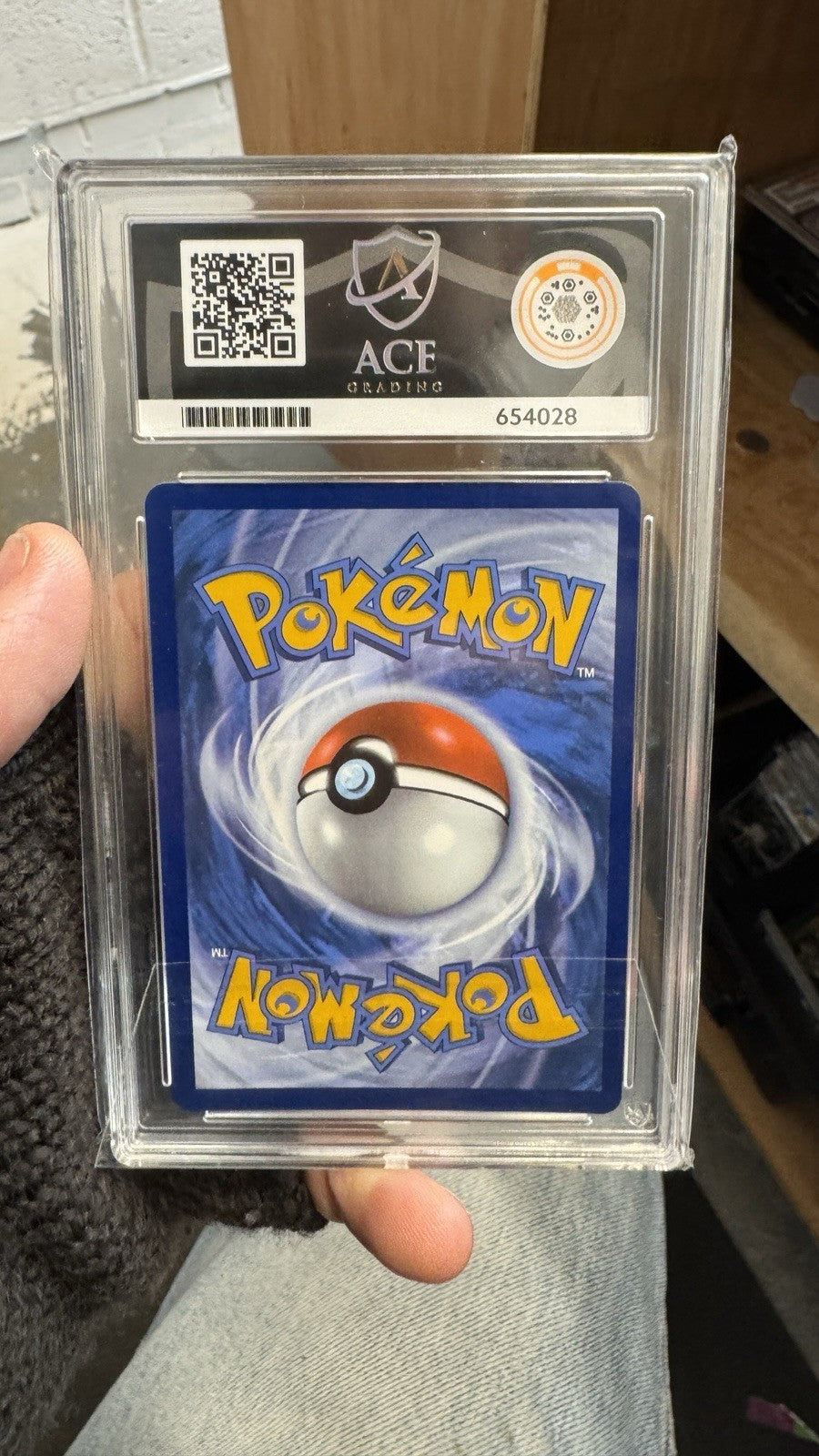 Team Rocket’s Tyranitar 096/182 - Pokemon Center Stamped - ACE 10 With Swirl